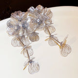 Flower Cutout Fishtail Pattern Heavy Metal Tassel Earrings